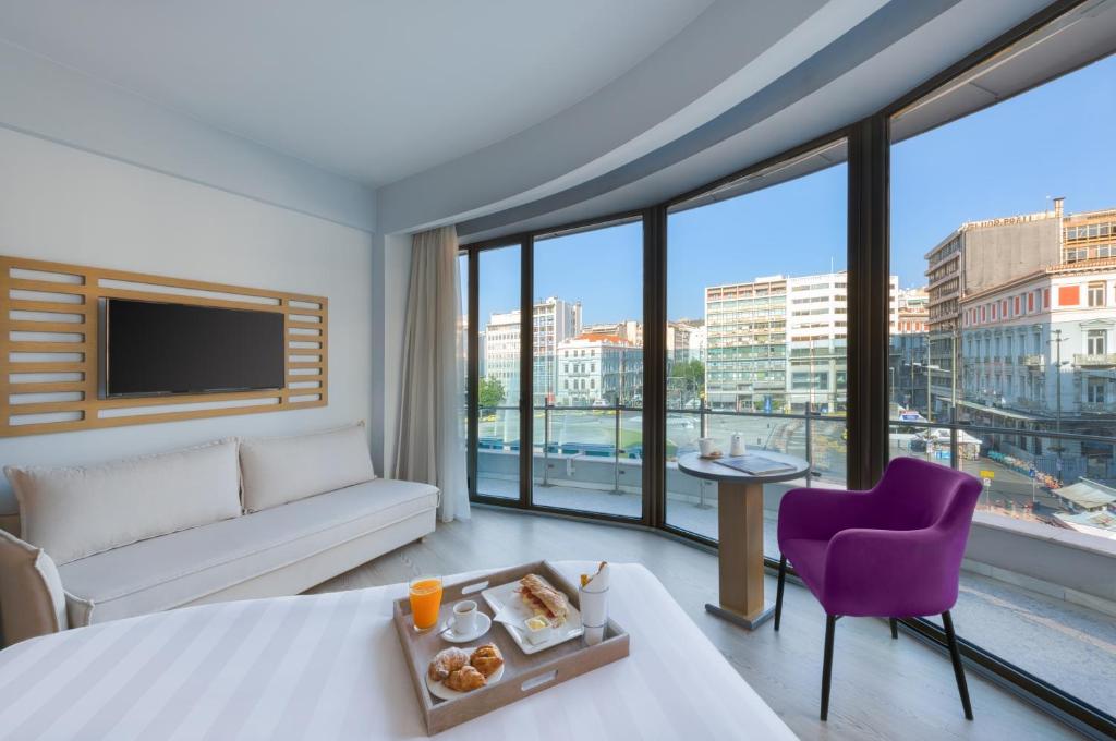 Postel nebo postele na pokoji v ubytování Athens Tiare by Mage Hotels