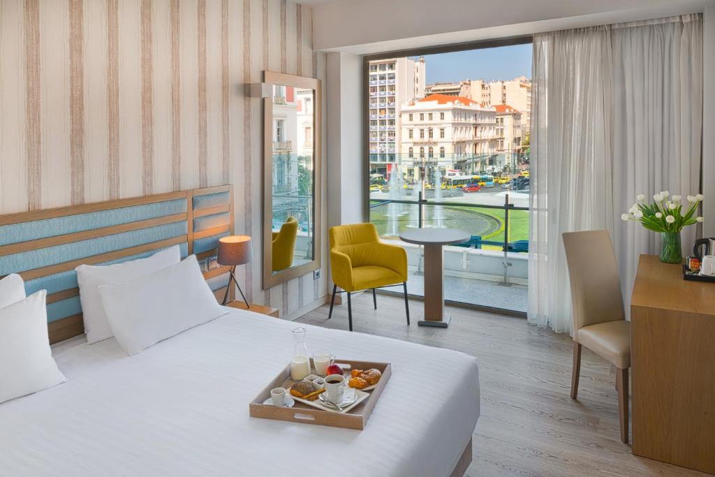 Postel nebo postele na pokoji v ubytování Athens Tiare by Mage Hotels