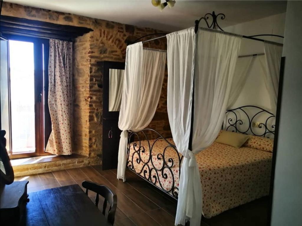 Ένα ή περισσότερα κρεβάτια σε δωμάτιο στο HOTEL RURAL TOCAMPAVI