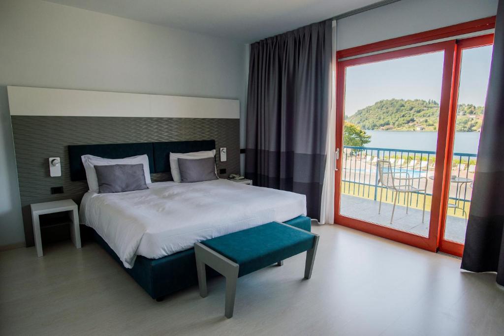 Postel nebo postele na pokoji v ubytování Hotel L'Approdo