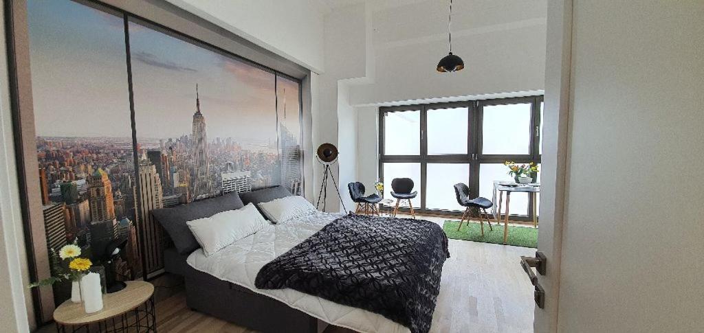 a bedroom with a large picture of a city at GreenPoint in Wiener Neustadt