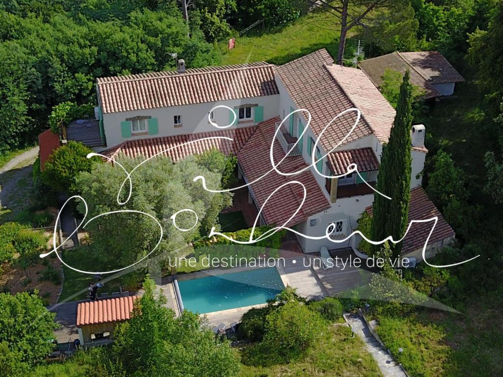 an aerial view of a house with a swimming pool at Villa Bonheur Vallespir in Céret