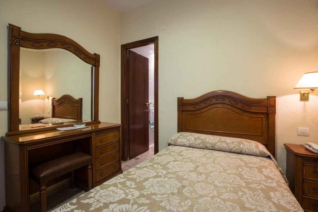 Postel nebo postele na pokoji v ubytování Hotel Riviera