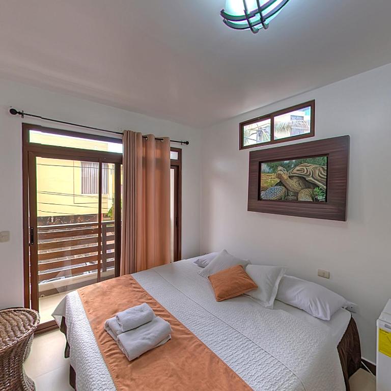 Postel nebo postele na pokoji v ubytování Hostal Costa del Pacifico