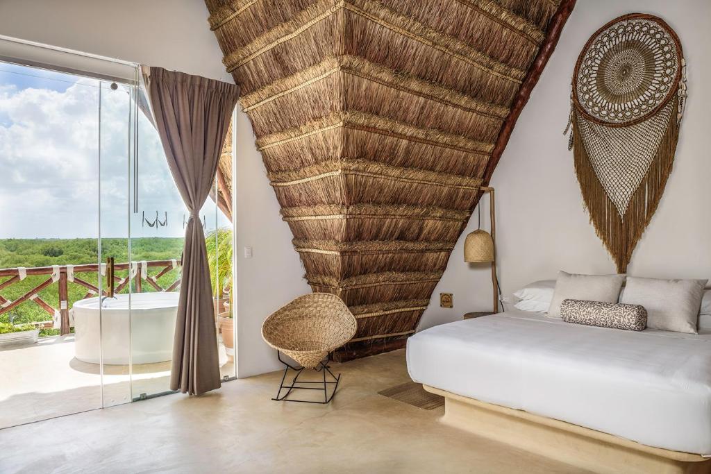 Postel nebo postele na pokoji v ubytování Hotel Villas Flamingos