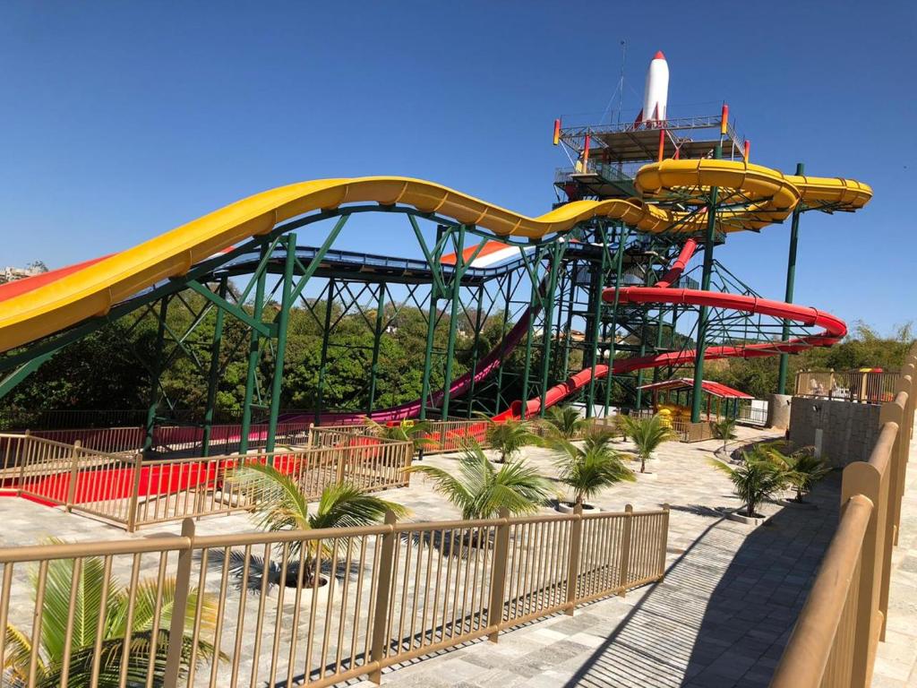 a water park with a roller coaster at Piazza diRoma - Apartamentos JN in Caldas Novas
