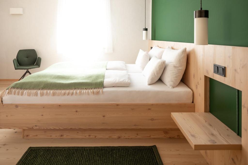 Postel nebo postele na pokoji v ubytování Hotel Neusacherhof
