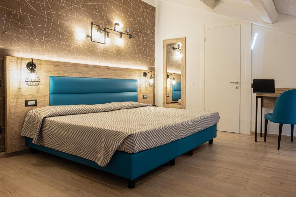 Postel nebo postele na pokoji v ubytování Cuneo Hotel