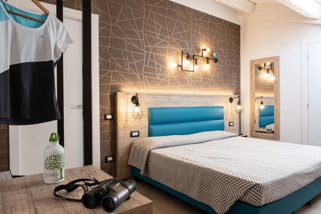 Postel nebo postele na pokoji v ubytování Cuneo Hotel
