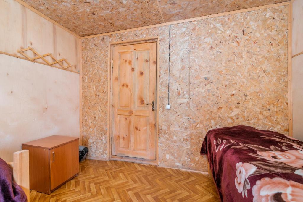 Postel nebo postele na pokoji v ubytování Guest House Old Omalo
