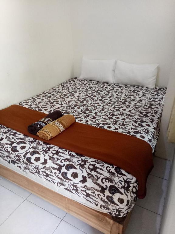 Letto o letti in una camera di Losmen Fadel Malioboro Jogja