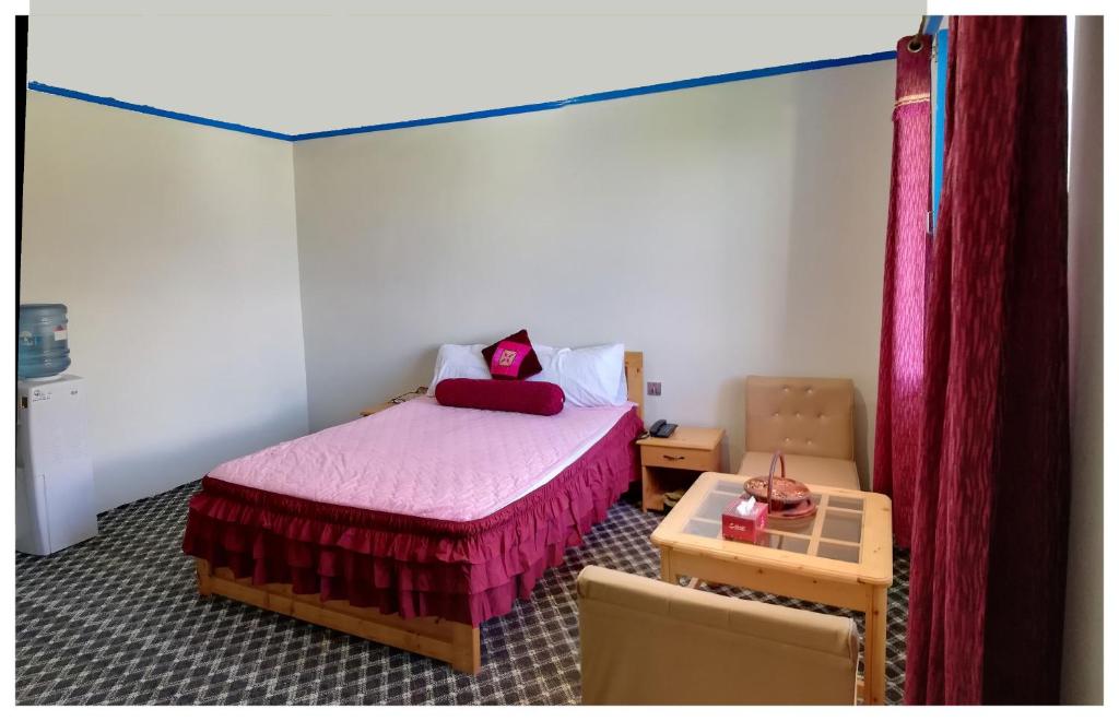 Voodi või voodid majutusasutuse Hotel Mountain Lodge Skardu toas