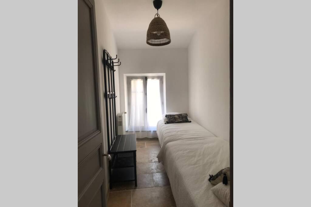 Postel nebo postele na pokoji v ubytování Maison rue Trivalle