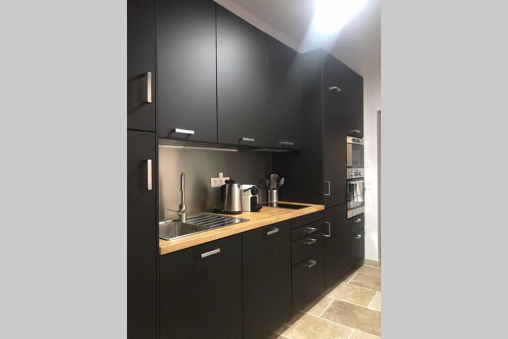 Kuchyň nebo kuchyňský kout v ubytování Maison rue Trivalle