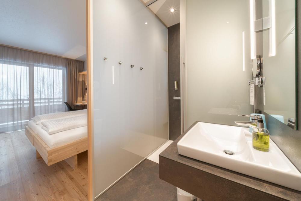 Postel nebo postele na pokoji v ubytování Tirol Lodge