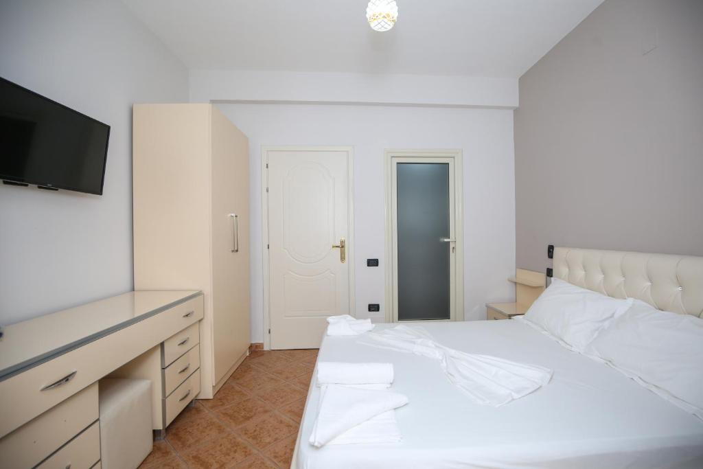 Postel nebo postele na pokoji v ubytování Hotel Vila Stefa