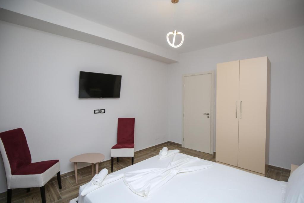 Postel nebo postele na pokoji v ubytování Hotel Vila Stefa