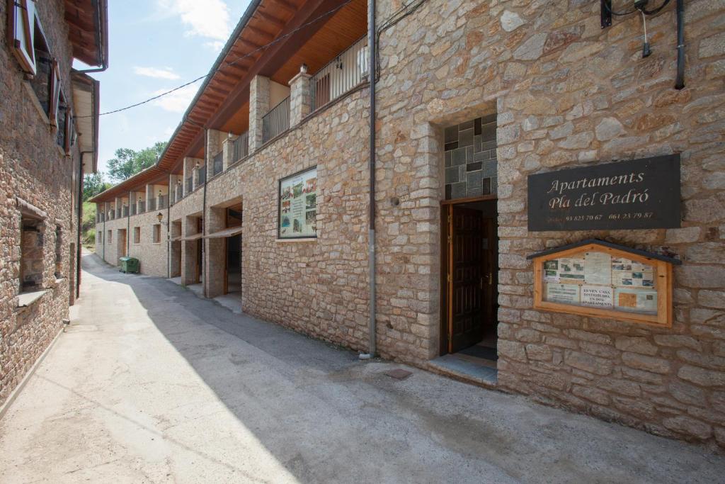 an empty alley in an old brick building at Apartaments Castellar de n'Hug in Castellar de NʼHug