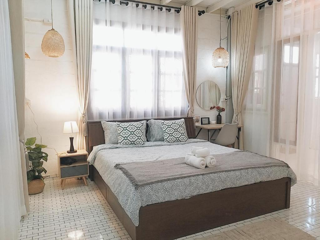 Postel nebo postele na pokoji v ubytování The Warehouse - Ayutthaya