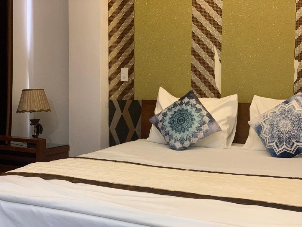 Ένα ή περισσότερα κρεβάτια σε δωμάτιο στο Hưng Thành Riverside Hotel