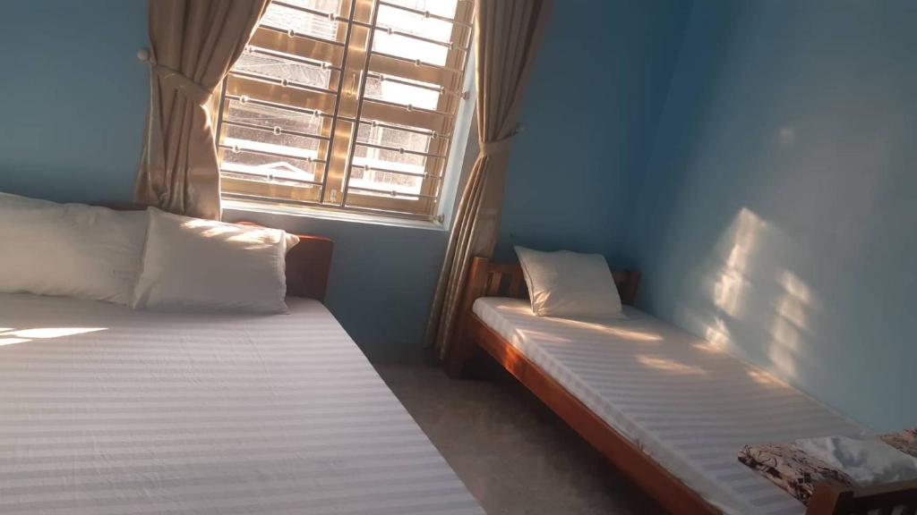 Postel nebo postele na pokoji v ubytování Hải Phận Homestay