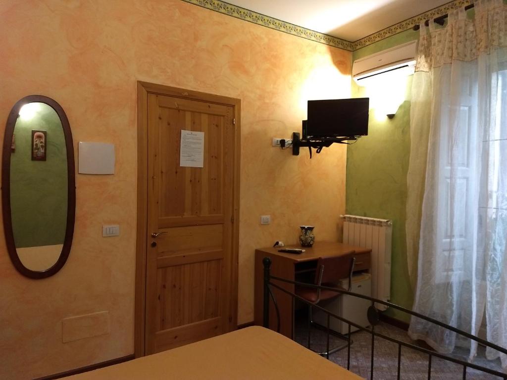 Postel nebo postele na pokoji v ubytování Palazzo Aprile