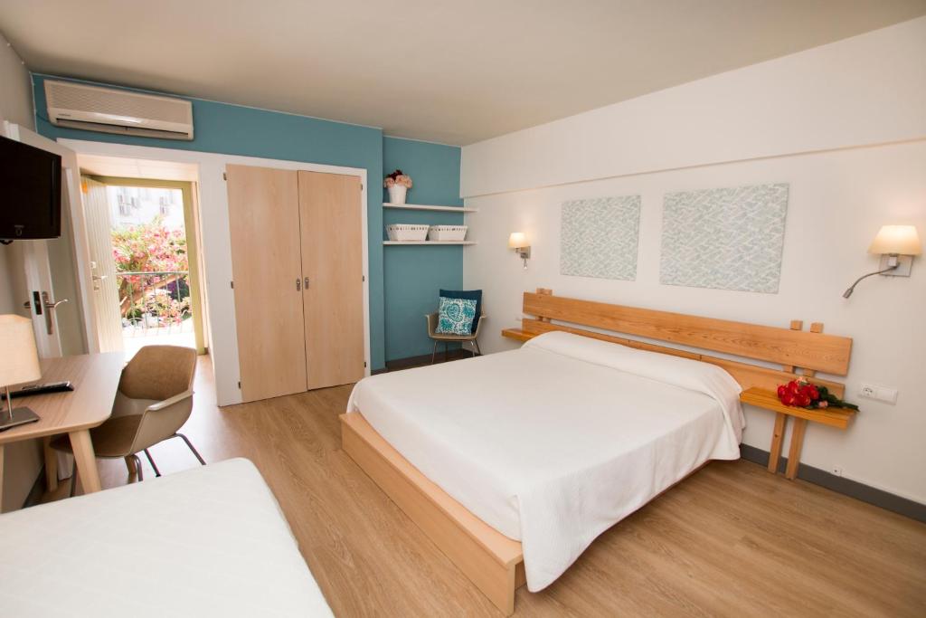 Postel nebo postele na pokoji v ubytování Hotel Yola