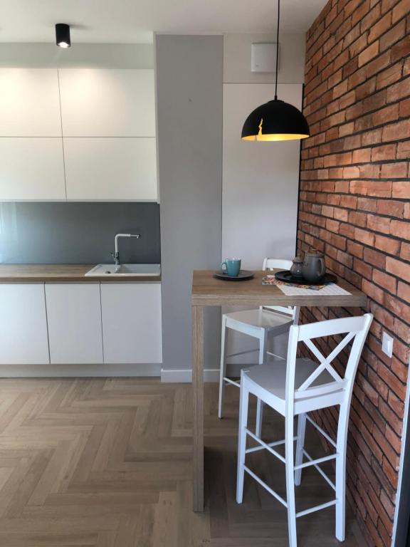 Η κουζίνα ή μικρή κουζίνα στο Apartament Zielone Zacisze
