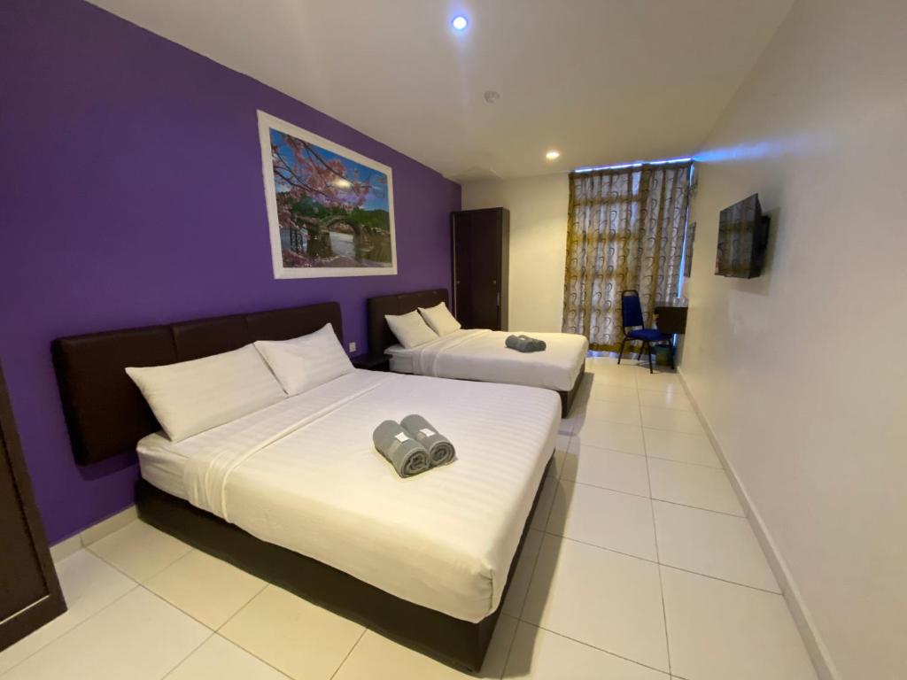 Postel nebo postele na pokoji v ubytování Hotel EC Double Star KLIA 1-KLIA 2