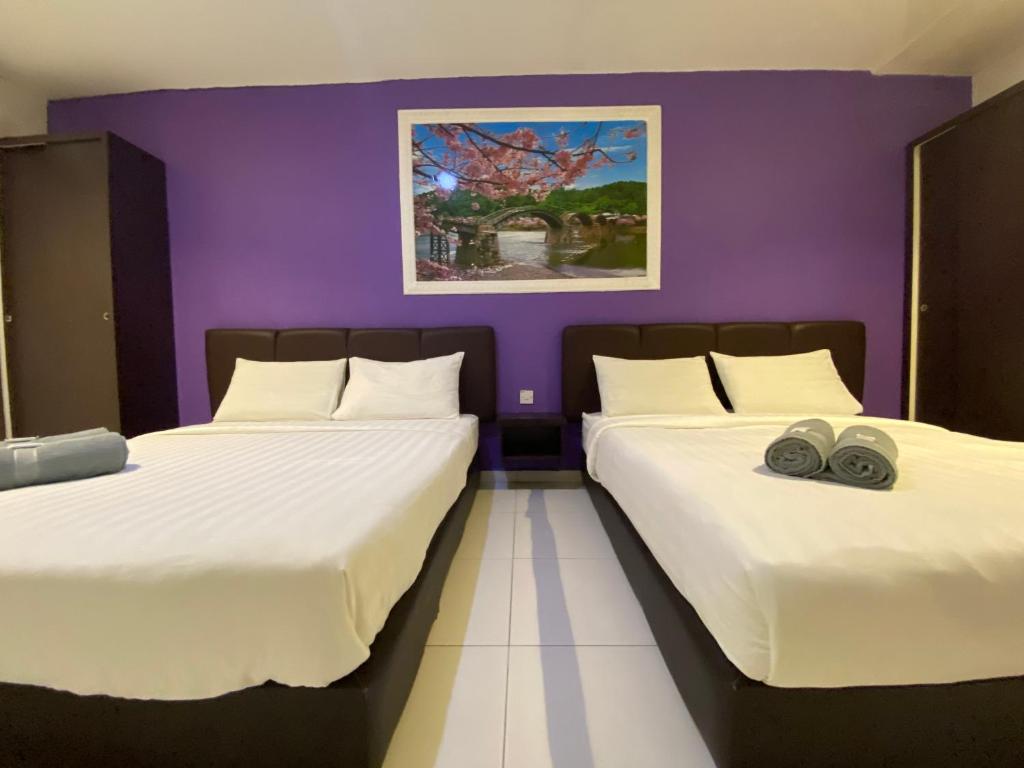 Postel nebo postele na pokoji v ubytování Hotel EC Double Star KLIA 1-KLIA 2