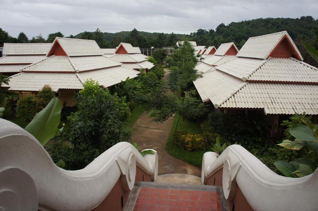an aerial view of a resort with roofs at Poonyamantra Resort in Ban Rai