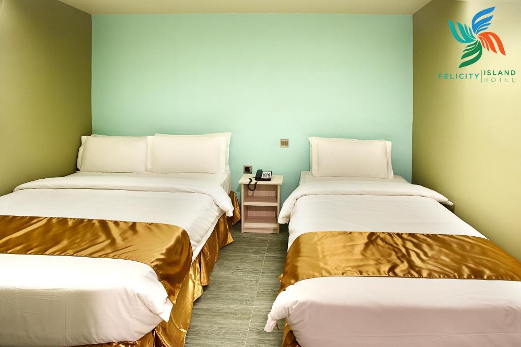 Katil atau katil-katil dalam bilik di Felicity Island Hotel