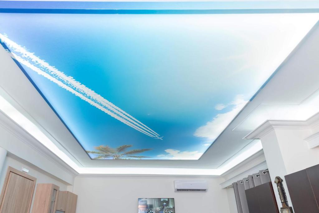 a ceiling with a painting of the sky at AS SUITES ROOM 14 in Rhodes Town