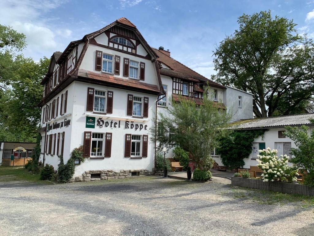 a large white building with the words social brooket at Hotel zur Köppe in Bad Klosterlausnitz