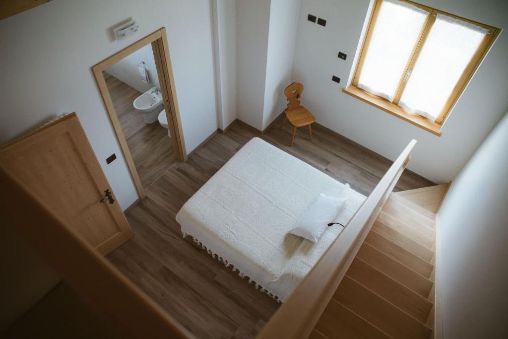 Posteľ alebo postele v izbe v ubytovaní Agritur Rizzi di Inama Ugo