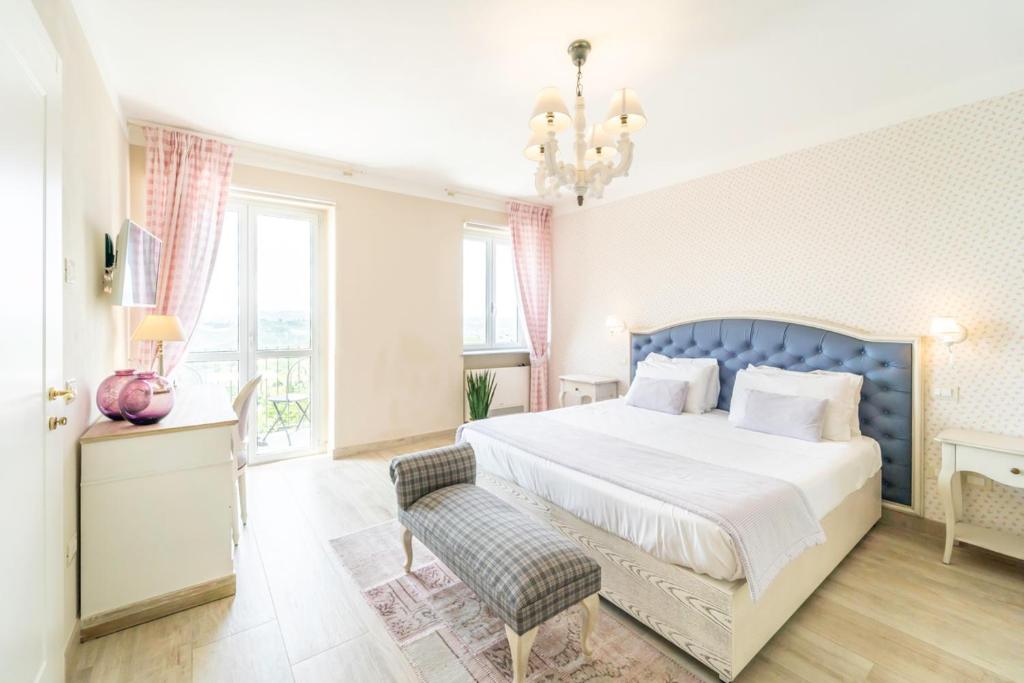 Postel nebo postele na pokoji v ubytování Borgo Vecchio Locanda di Charme