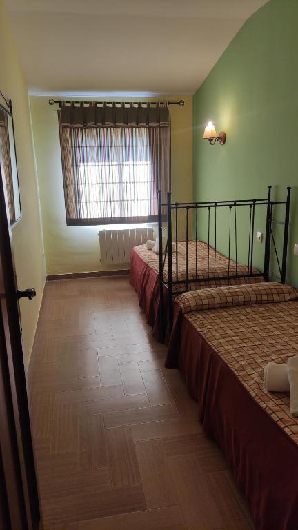 Cama o camas de una habitación en Hotel Rural Puerto Mágina