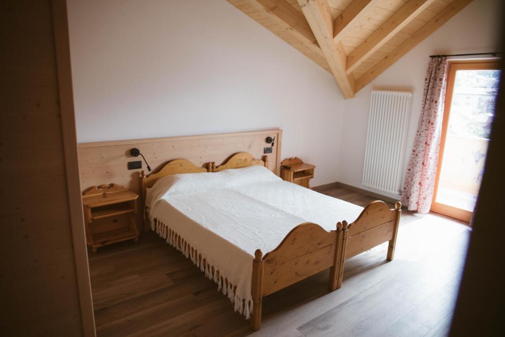 Posteľ alebo postele v izbe v ubytovaní Agritur Rizzi di Inama Ugo