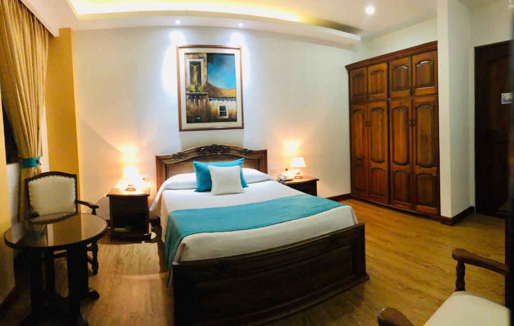 Postel nebo postele na pokoji v ubytování El Gran Hotel de Pereira