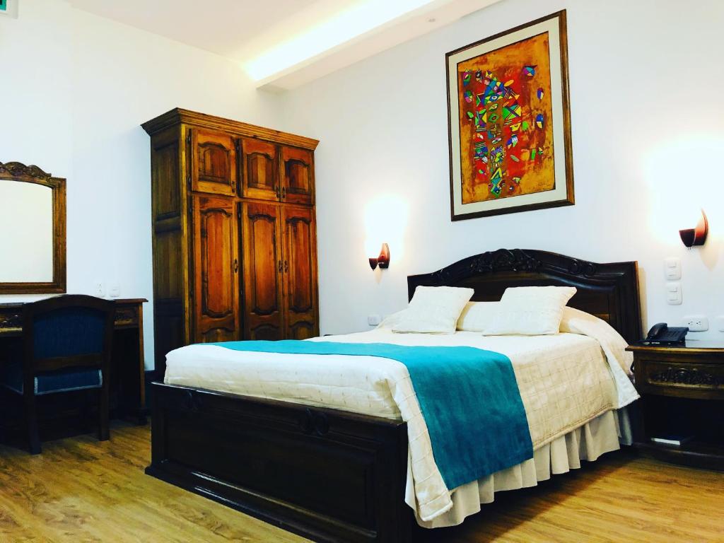 Postel nebo postele na pokoji v ubytování El Gran Hotel de Pereira