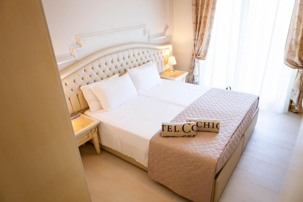 Postel nebo postele na pokoji v ubytování Hotel Conchiglia