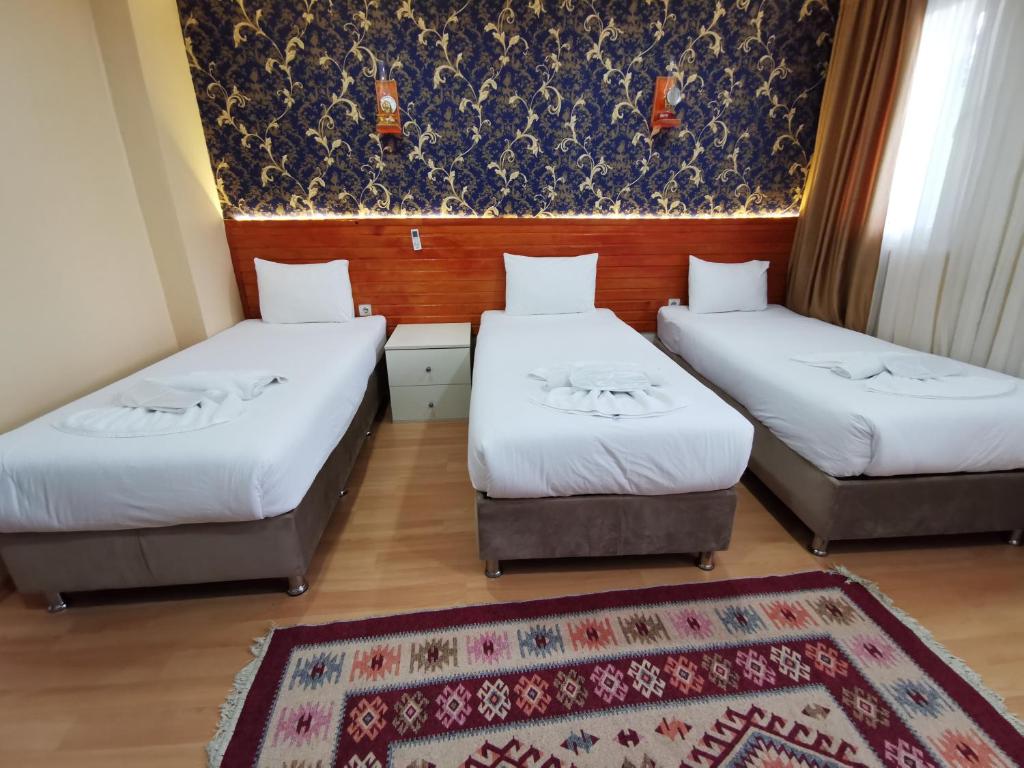 Postel nebo postele na pokoji v ubytování Otantik Hotel