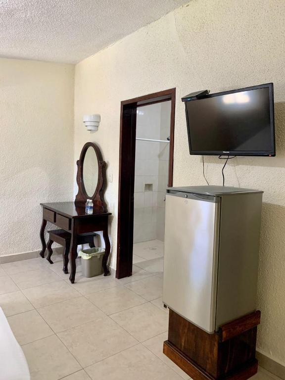 TV a/nebo společenská místnost v ubytování Hotel Caribe