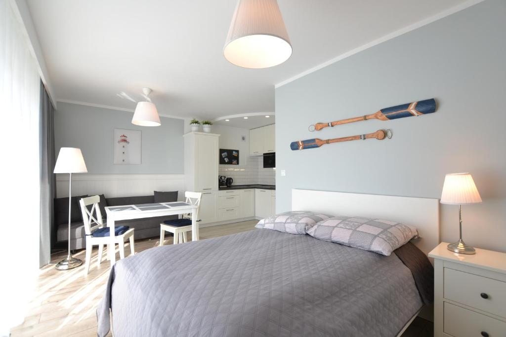 Katil atau katil-katil dalam bilik di Darłówko Apartament Morski VIII