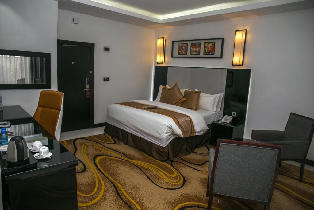 Postel nebo postele na pokoji v ubytování GreenPoint Hotel