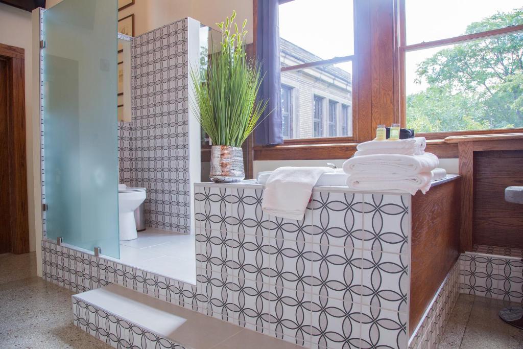 Postel nebo postele na pokoji v ubytování School 31 Lofts