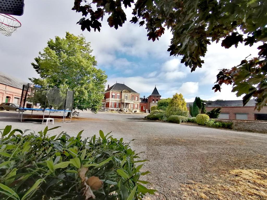 a basketball court in front of a building at Studio Ferme de Bonavis in Banteux