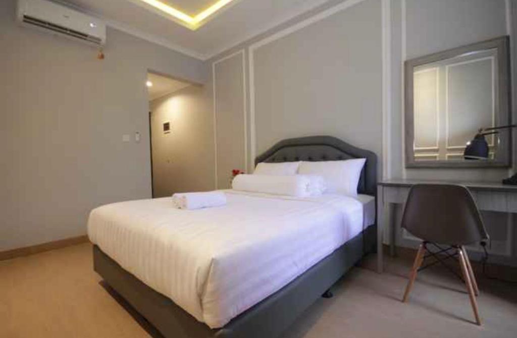 Postel nebo postele na pokoji v ubytování Flamboyan Residence Cipete