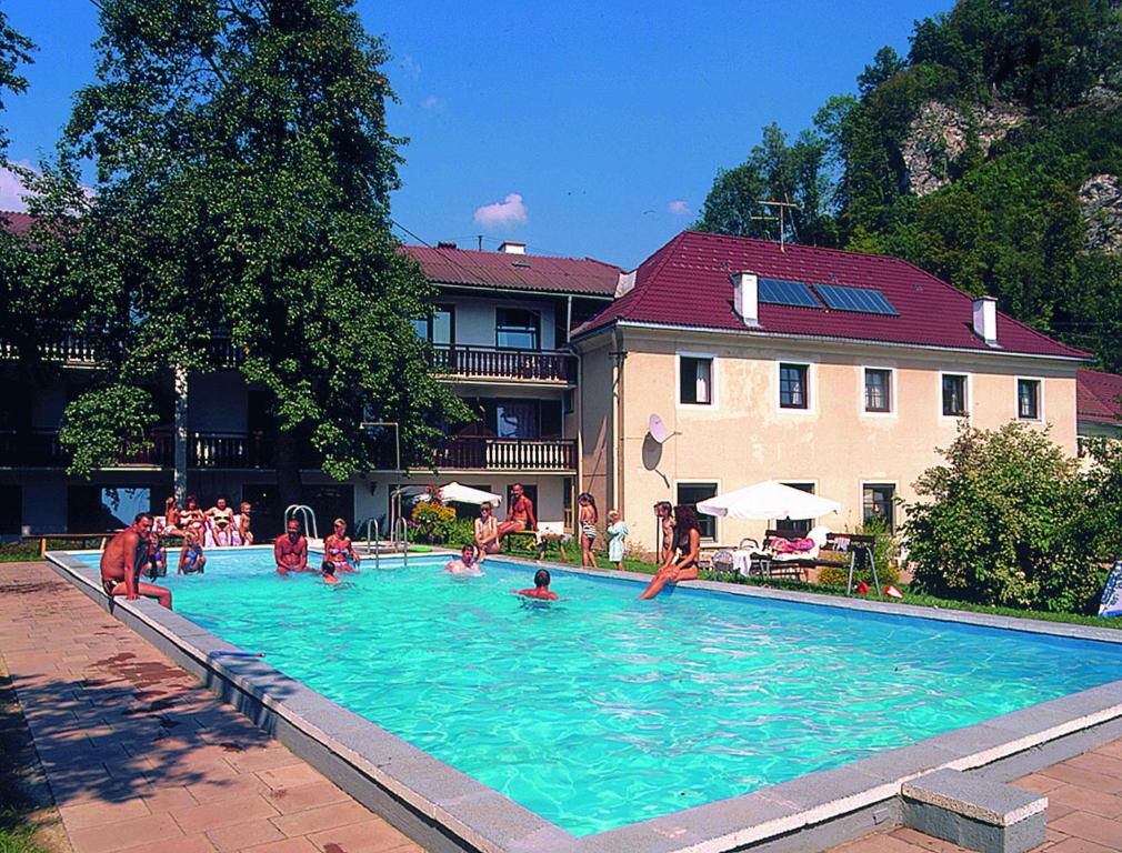 a group of people playing in a swimming pool at Gasthof Pension Rabl in Völkermarkt