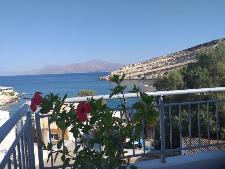 a balcony with a view of a body of water at Alexandra`s House in Matala